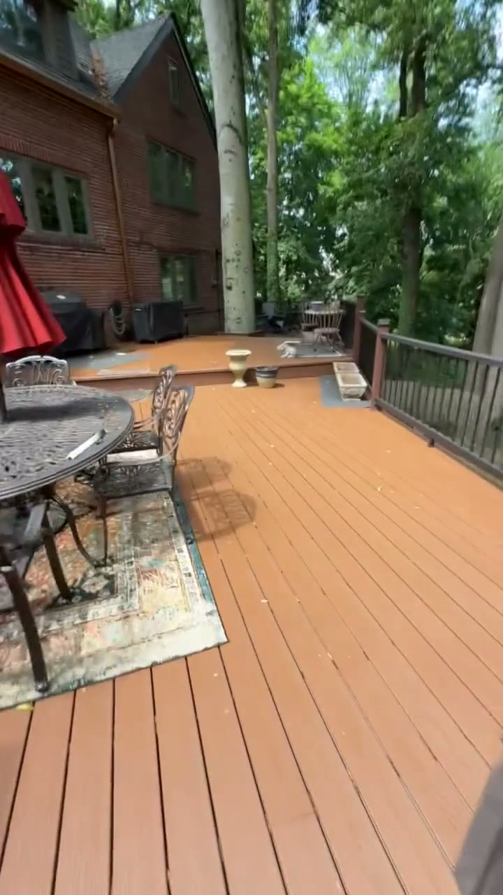 Walkthrough of a completed multi-level composite deck showing the dining area, grill station, and lattice-screened lounge, by Universal Design LLC in Bucks County PA.