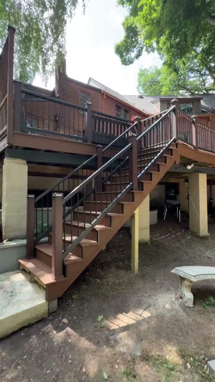 Elevated deck framing and support columns showing the structural work behind a second-story deck build, by Universal Design LLC in Bucks County PA.